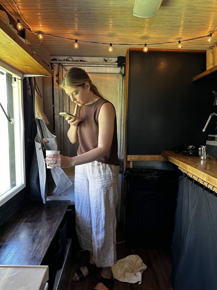 Slow Drip co-owner Emme Shover prepares a post for the coffee trucks social media accounts