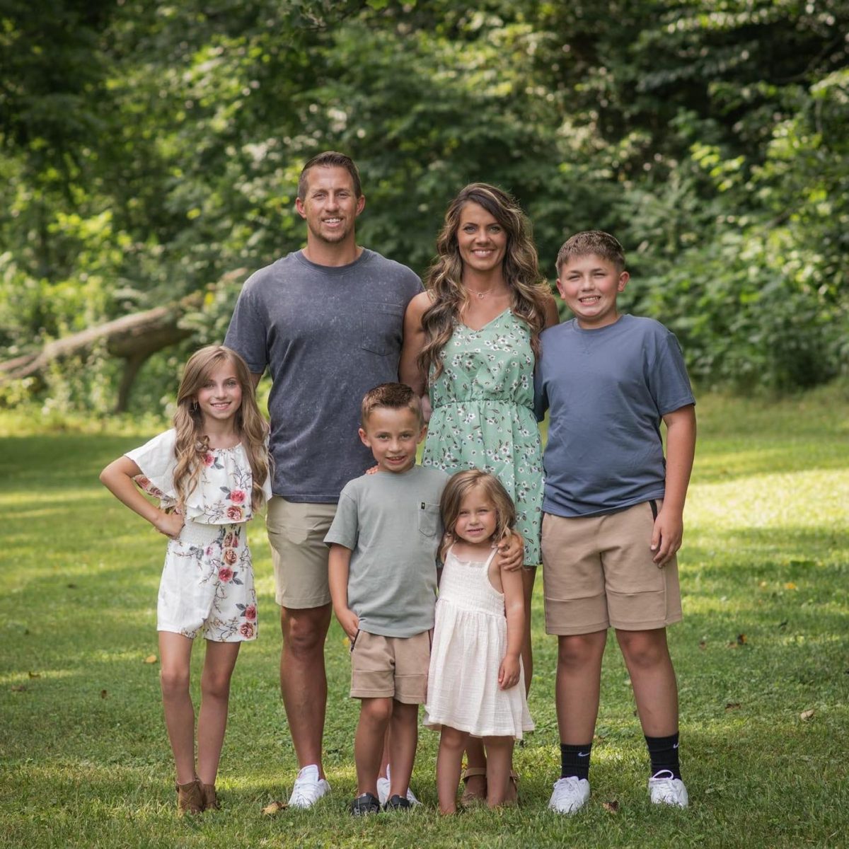 Brandon Walker with his wife and children