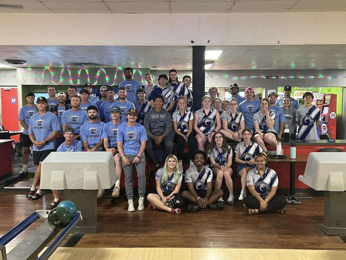 The SSU bowling and baseball teams pose for a picture after practice