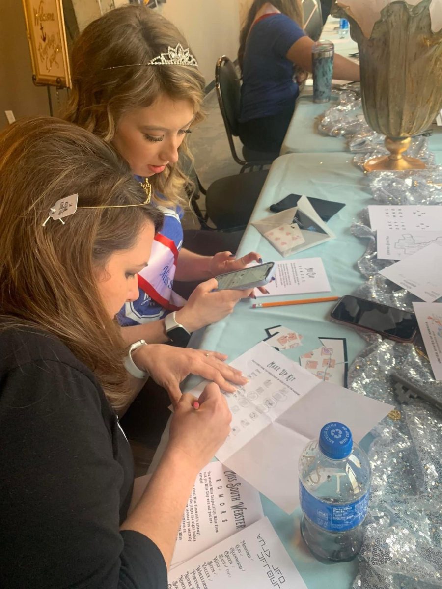Adrienne Whitley, top left, working on a puzzle for the 2022 Murder Mystery.